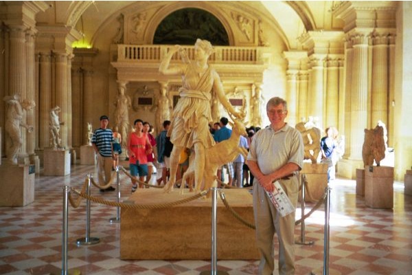 The webmaster in front of a statute of the Goddess Diana.
